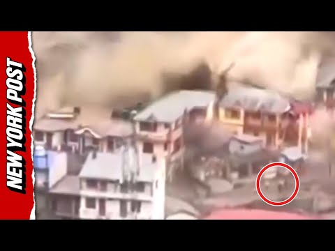 Horrific moment screaming residents swept away while trying to escape flood in India