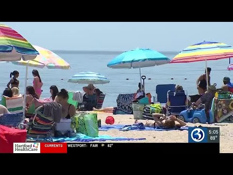 Families cool off at Sound View Beach in Old Lyme