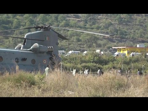 Rescued Indian workers board helicopter to be airlifted to hospital in Rishikesh | AFP