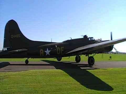 B-17 and three Mustangs