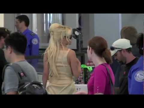 WATCH: Pamela Anderson Catches a Flight Dressed in her DWTS Outfits