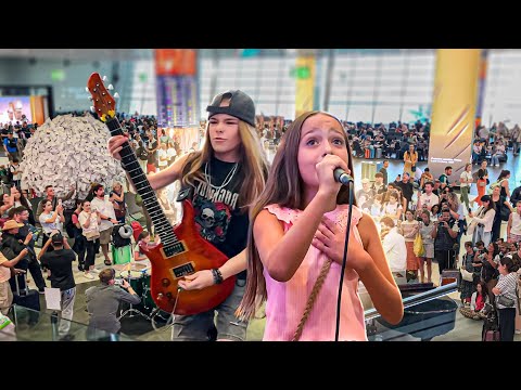 Amazing 9 years old perform OVER THE RAINBOW at the airport!