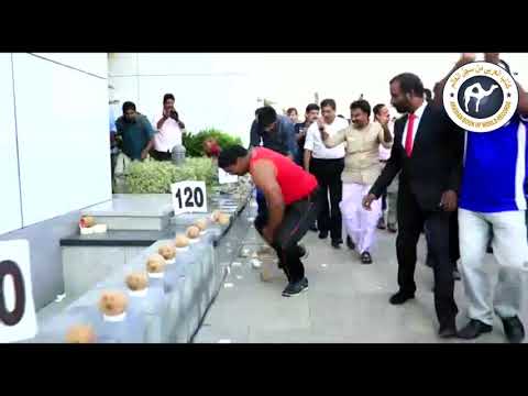 MOST COCONUTS SMASHED WITH ONE HAND IN ONE MINUTE