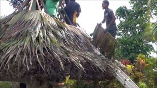 preview picture of video 'Uprising Beach Resort Re-roofing A Bure Hut'