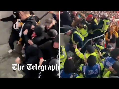 Hungarian fans clash with police during England game at Wembley