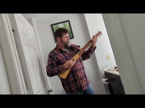 Demo nearly 30-year old Martin Backpacker guitar