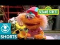 Sesame Street Elmo Helps Zoe Ride A Scooter