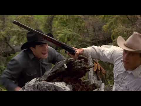 Trailer cutaway: Ennis in a dim room; the score’s single guitar line hangs in the air