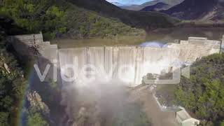 Beautiful aerial shot over a dam in full flood stage in Ojai California with rainbow 池田直弘神戸 池田直弘