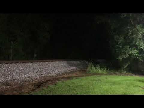 Very fast csx freight train at night