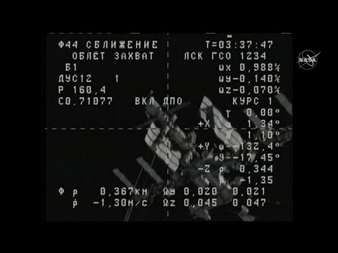 Unmanned space capsule docks at the ISS