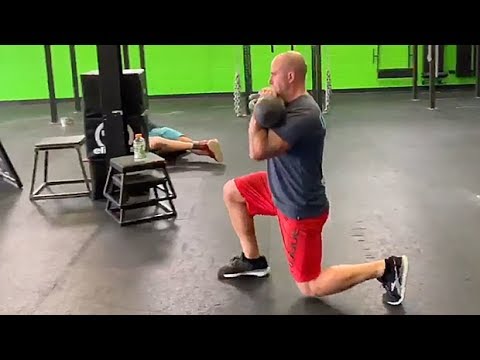 Double-Kettlebell Front Rack Walking Lunge