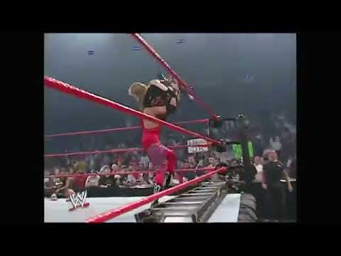Christian throws Spike Dudley through table