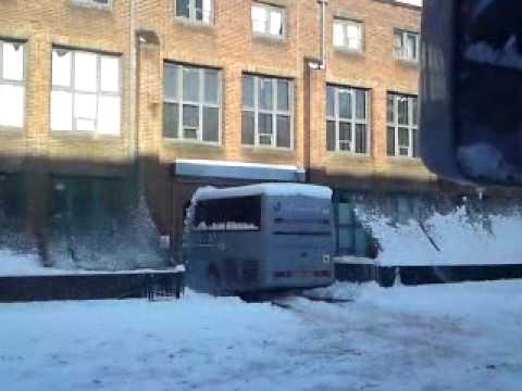 bss coach leaving depot in snow