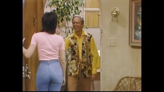 Joyce Dewitt in blue stone washed jeans answering door