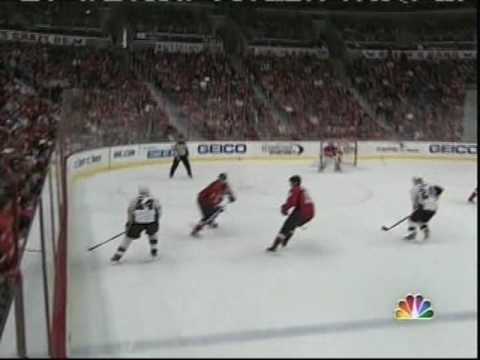Brian Pothier hipchecks Brooks Orpik