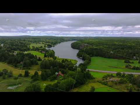 Aerial views showcase the Aland archipelago in Finland and one of its fjord, with clouds drifting