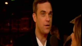 Robbie Williams on the Red Carpet live at the brits 2010