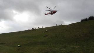 preview picture of video 'Coastguard Helicopter 104 picking a casualty up off the downs west sussex on the 21/01/2012'