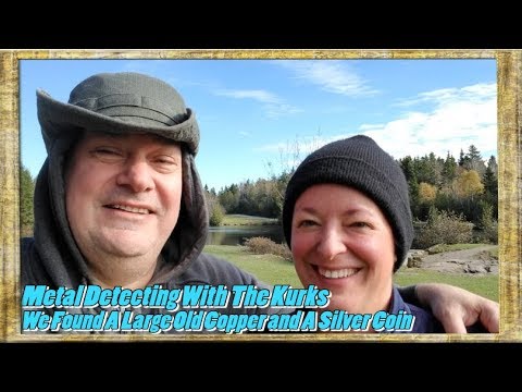 We found an large old copper coin and 1910 Silver 50 cent piece