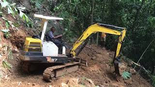 Excavator Operator Builds The Road