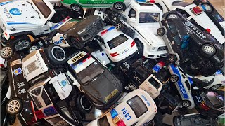 Box full of police car toy cars