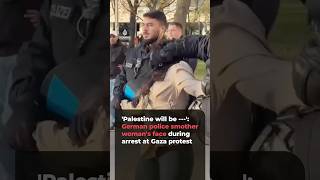 German police officer restrains Gaza protest activist's mouth during Berlin arrest