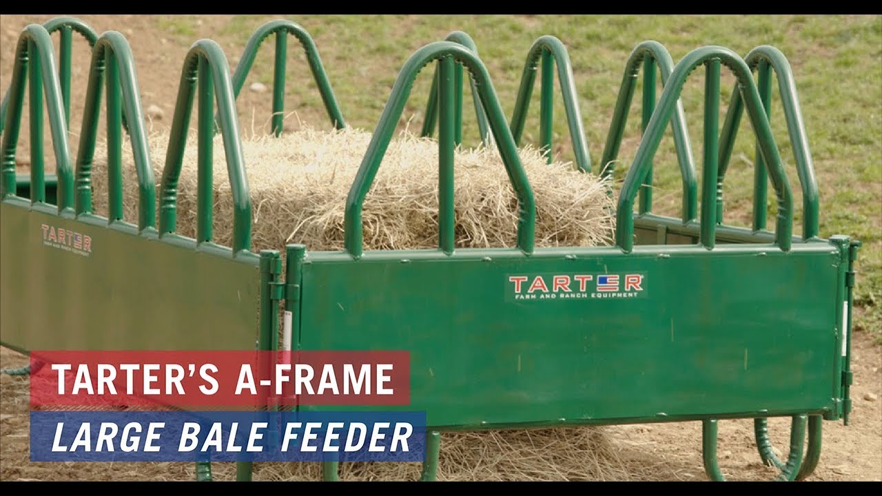 Two horses eating hay from Tarter’s A-Frame Large Bale Feeder