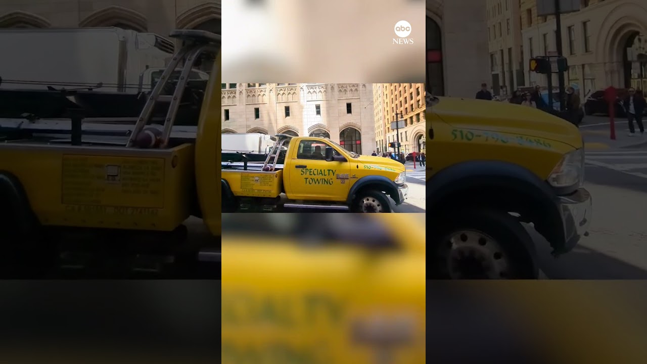 Couple accuses tow-truck driver of trying to take moving car in the middle of traffic