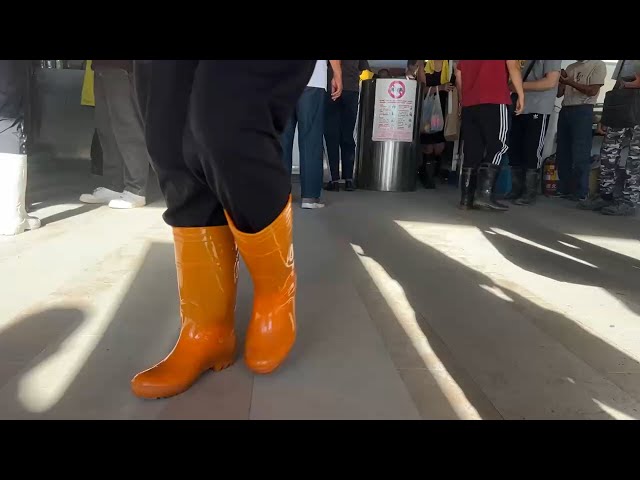 Rain boots symbolize care in Hualien flood