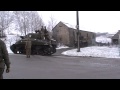 Sherman Tank driving through the snow near Bastogne