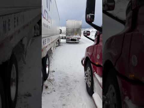 Insane semi truck wreck in snowy pass on Arizona I-40 west ( driver lives somehow)