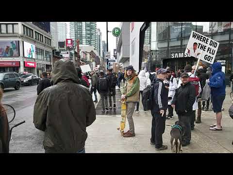 Toronto anti lockdown protest crowd and police at Dundas Square on Yonge Street on May 8 2021