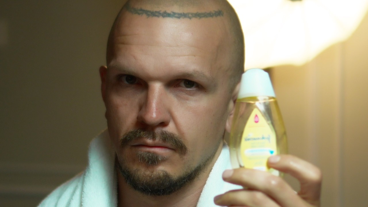 Elder Tattooed Millennial Skull Shaving Session Under Slow Groovy Electric Guitar 4K 50fps