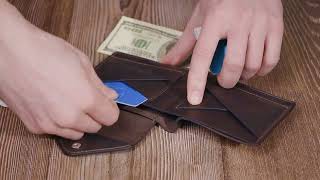 Вінтажний гаманець з монетницею із натуральної шкіри GRANDE PELLE 16803 коричневий