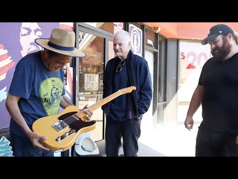 Gifting a Guitar to Roberto at Norman's Rare Guitars