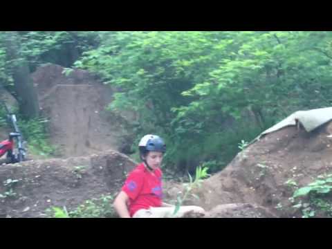 Kid body slams dirt jump!!