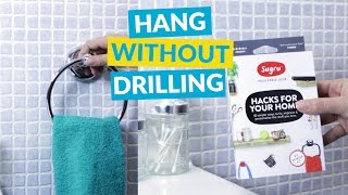 The Easiest Way to Hang Anything on Your Walls (without Using a Drill)