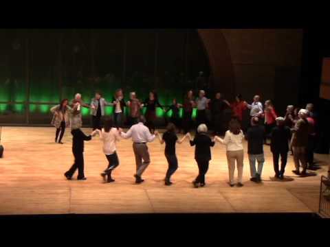 Image of Hi-Dukes live performance of Thalassaki Mou in concert as a quintet at the University of Missouri-St. Louis, Touhill Performance Center Lee Theater in 2016 with the audience dancing on stage.