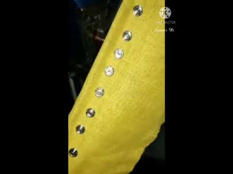 Automatic snap button rivet attaching machine