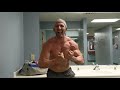 After arm workout posing in the locker room classic physique bodybuilding