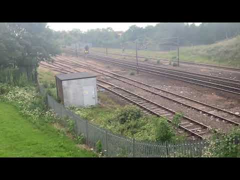 Colas Class 56302 + DB Class 66037 with ballast wagons passes Darlington on Millerhill to Doncaster