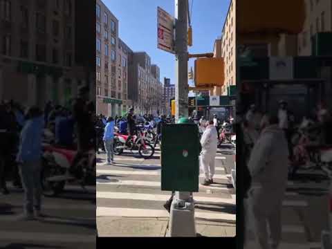 ALPO MARTINEZ on a dirt bike in east Harlem doing wheelies