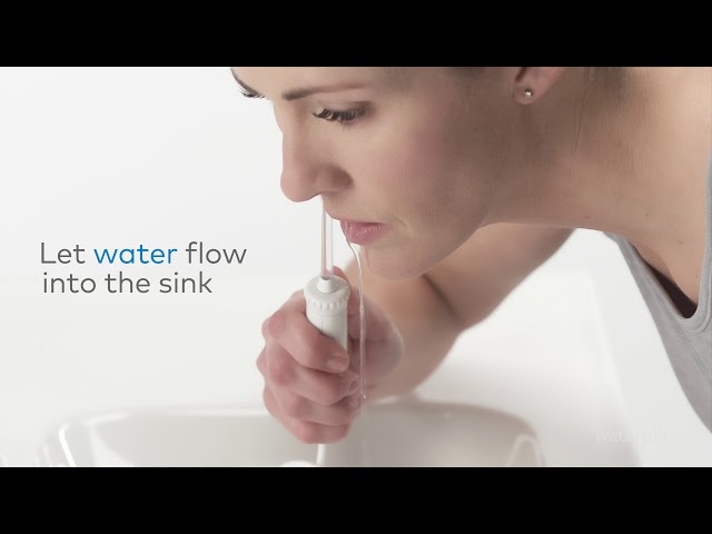 Waterpik WP-100 Irrigador Dental Eléctrico video