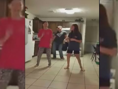 What's Dad doing? Father videobombs daughters' kitchen dance
