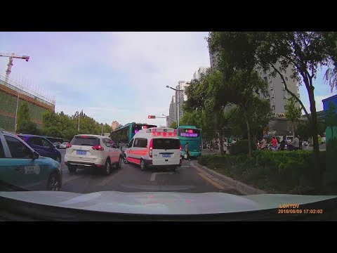 Two buses initiative give way for Ambulance, Shandong China.