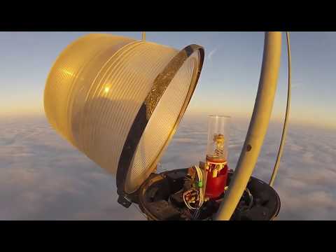 Changing a Bulb Atop a 2000 Ft Tower Looks As Crazy As It Sounds ...