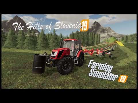 Preparing the grass for baling in The Hills of Slovenia