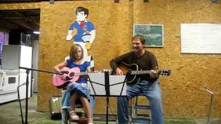 Dominique sings and plays Main Road by Lucinda Williams