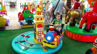 Super fun Amusement indoor park with Kids playing and racing a train, a boat